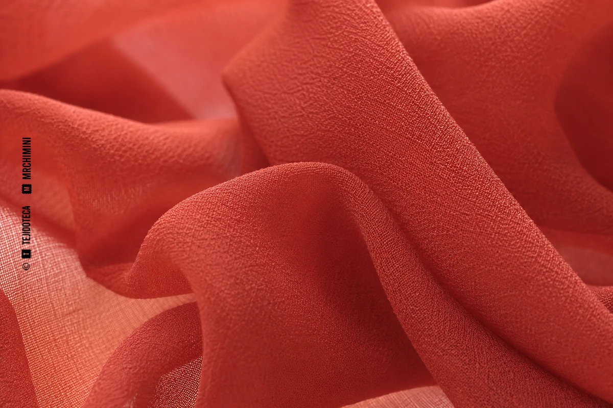 Macrofotografía de georgette en coral quemado #C85F55
