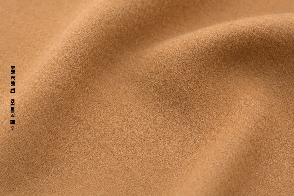 Macrofotografía de tejido de paño en camel #B68A5A