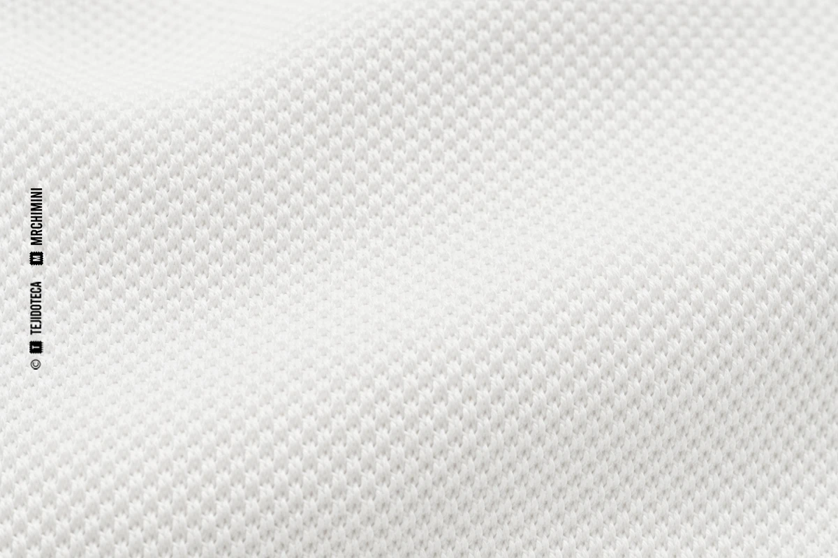 Macrofotografía de tejido piqué en blanco óptico #F4F4F0