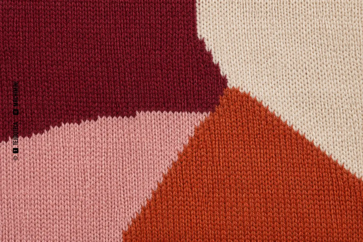 INTARSIA — macro Macro de intarsia de punto en burdeos, terracota, rosa y marfil