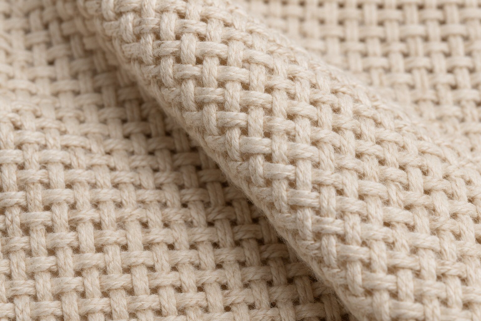 Detalle ilustrativo de monk’s cloth con hilos agrupados y cuadrícula abierta