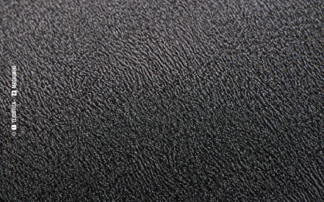 Detalle macro de un tejido con el pelo nivelado mediante tundido